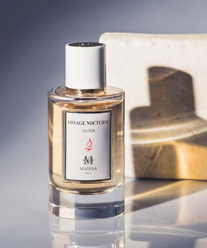 Elegant bottle of VOYAGE NOCTURNE by Maison Maïssa and the5thscent; a luxurious woody and floral fragrance with sandalwood and rose berry notes.