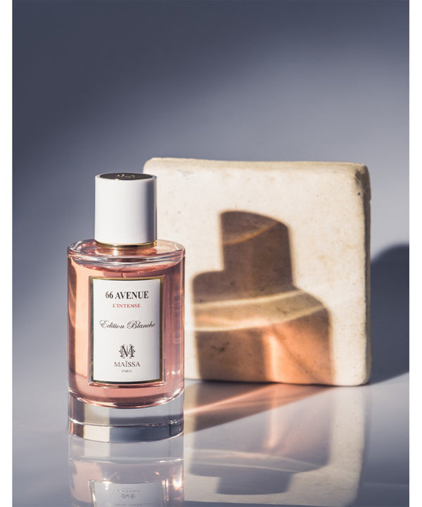 Luxurious 66 Avenue Maïssa Perfume by Maison Maïssa, a Woody Floral Unisex scent, showcased by the5thscent in elegant lighting.