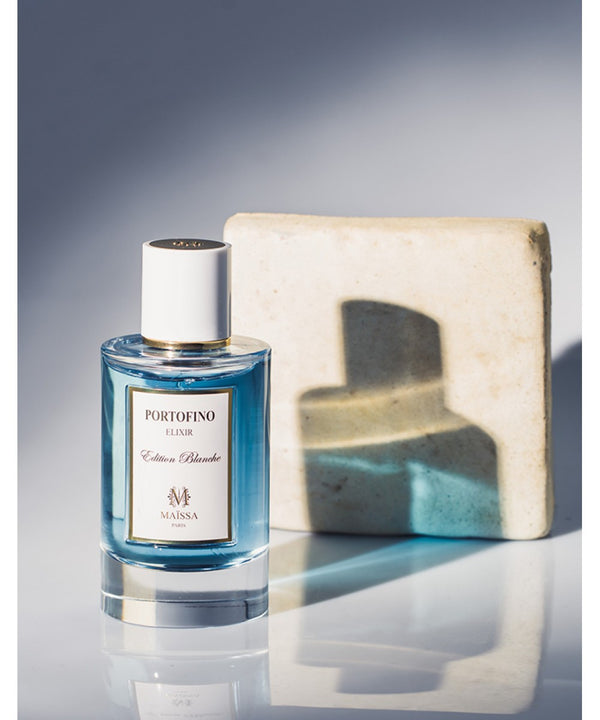 Luxurious PORTOFINO fragrance by Maison Maïssa, combining floral and oriental notes with exclusivity by the5thscent, set against marble.