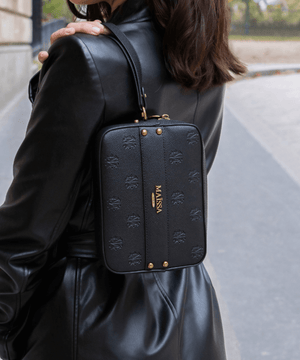 Luxurious Pochette Toscane from COFFRET TOSCANE 66 AVENUE by Maison Maïssa, featuring elegant black leather with gold signature, via the5thscent.