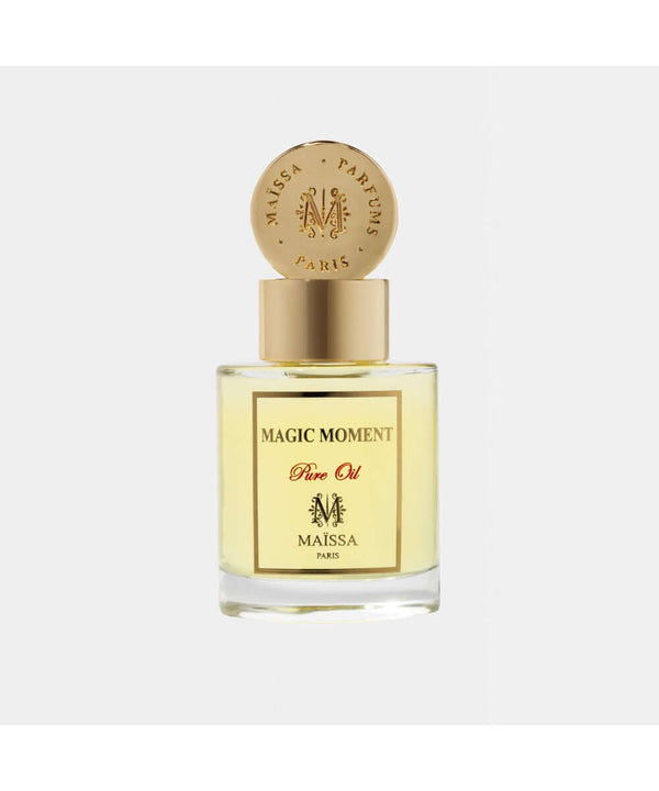 Luxurious PURE OIL MAGIC MOMENT perfume by Maison Maïssa in an elegant glass bottle, featuring a woody and sweet fragrance by the5thscent.