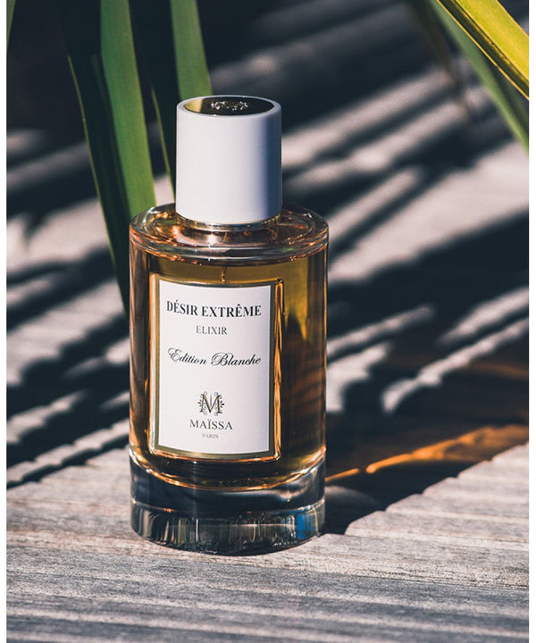 Luxurious DESIR EXTREME perfume by Maison Maïssa, a blend of oriental and woody notes, available at the5thscent. Elegant glass bottle.