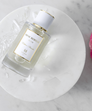 Luxurious bottle of MUSC REBELLE by Maison Maïssa and the5thscent, a unisex floral musk fragrance exuding elegance and exclusivity.