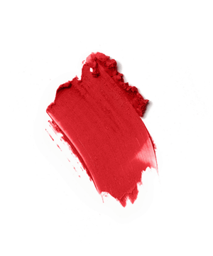 A bold red lipstick smear on white background showcasing luxurious color and texture, representing high-end cosmetics quality and allure.