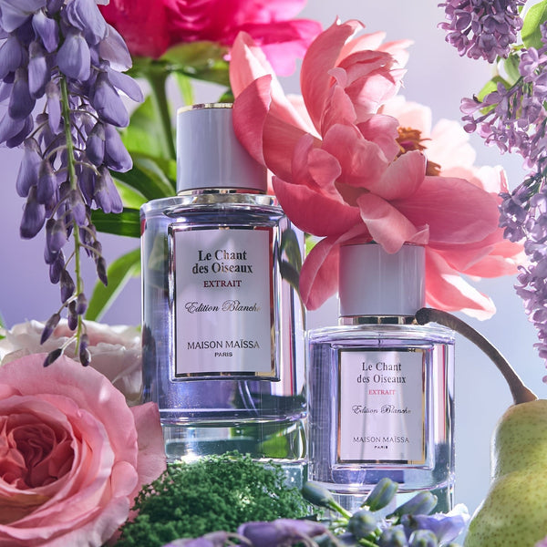 Le Chant des Oiseaux Extrait by Maison Maïssa bottles with pink flowers, lilac and a pear