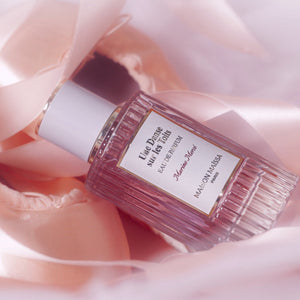 Maison Maïssa Une Danse sur les Toits perfume bottle in a soft pink luxury setting
