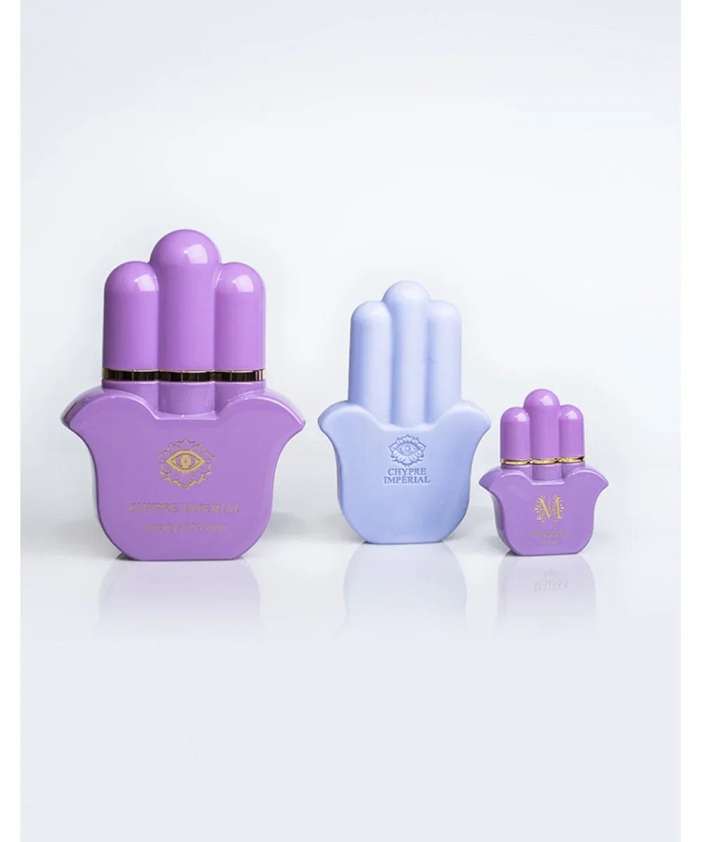 Maïssa Chypre Imperial perfume bottles in purple and lavender hamsa shapes with black and gold decorative box