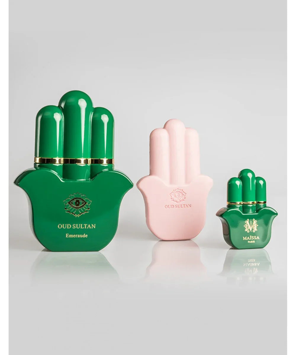 Oud Sultan Emeraude perfume bottles in green and pink hand-shaped design with black luxury box