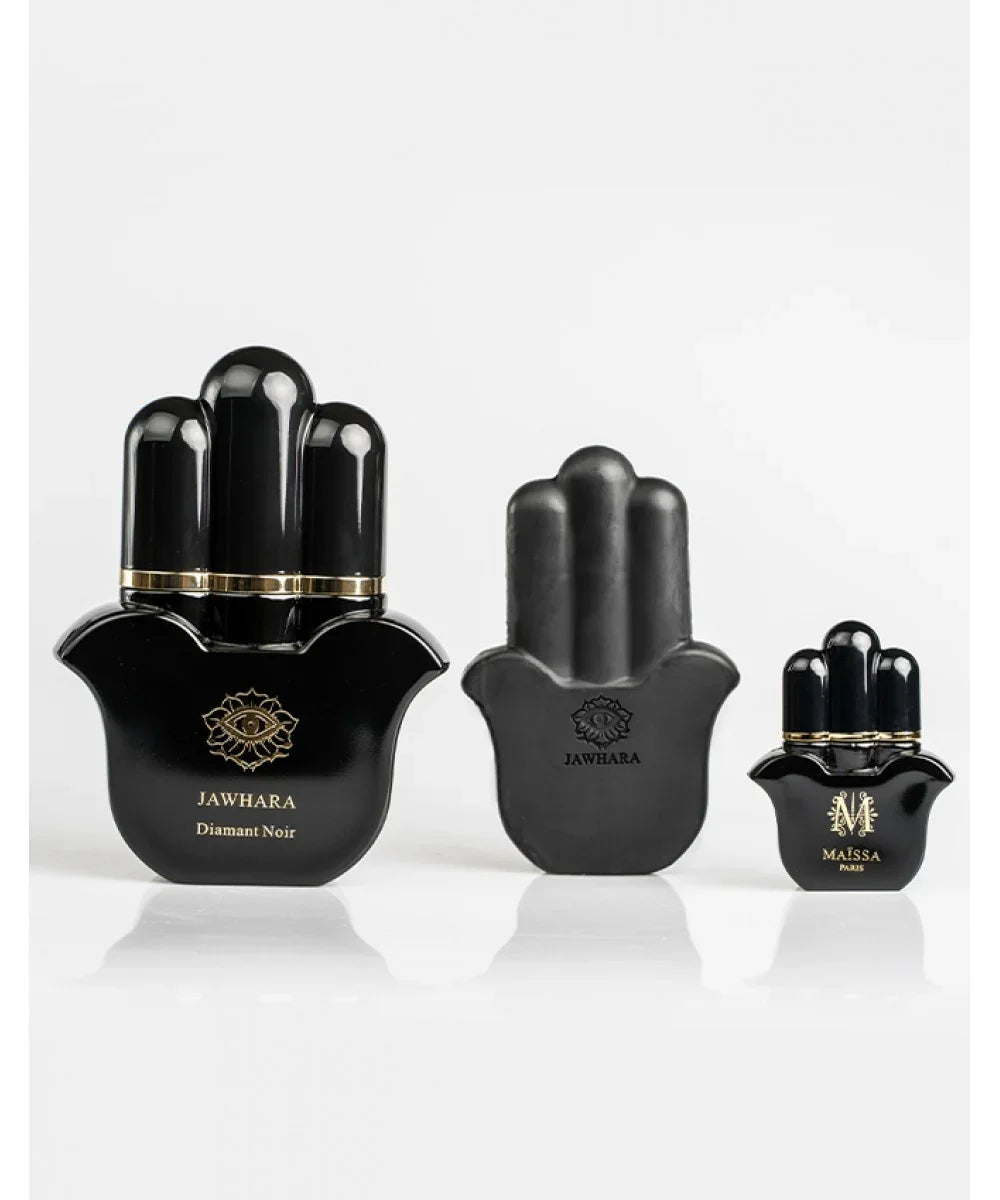 Set of black Jawhara Diamant Noir perfume bottles and decorative packaging with gold accents