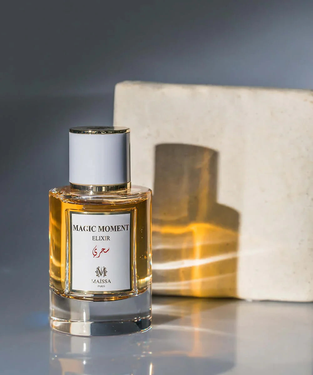 Magic Moment Elixir perfume by Maissa Paris in clear glass bottle with gold accents