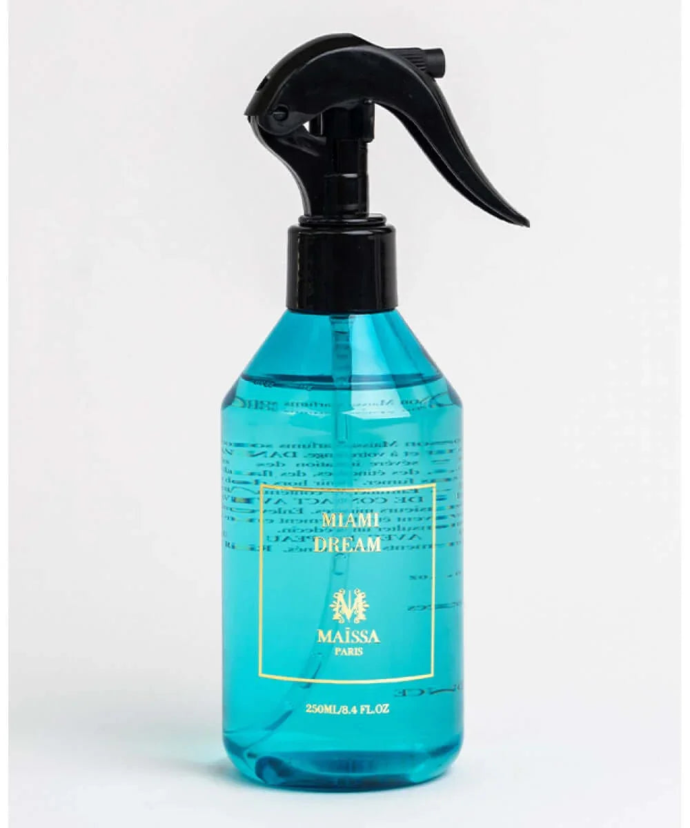 Blue liquid spray bottle labeled Miami Dream by Maïssa Paris with black trigger spray