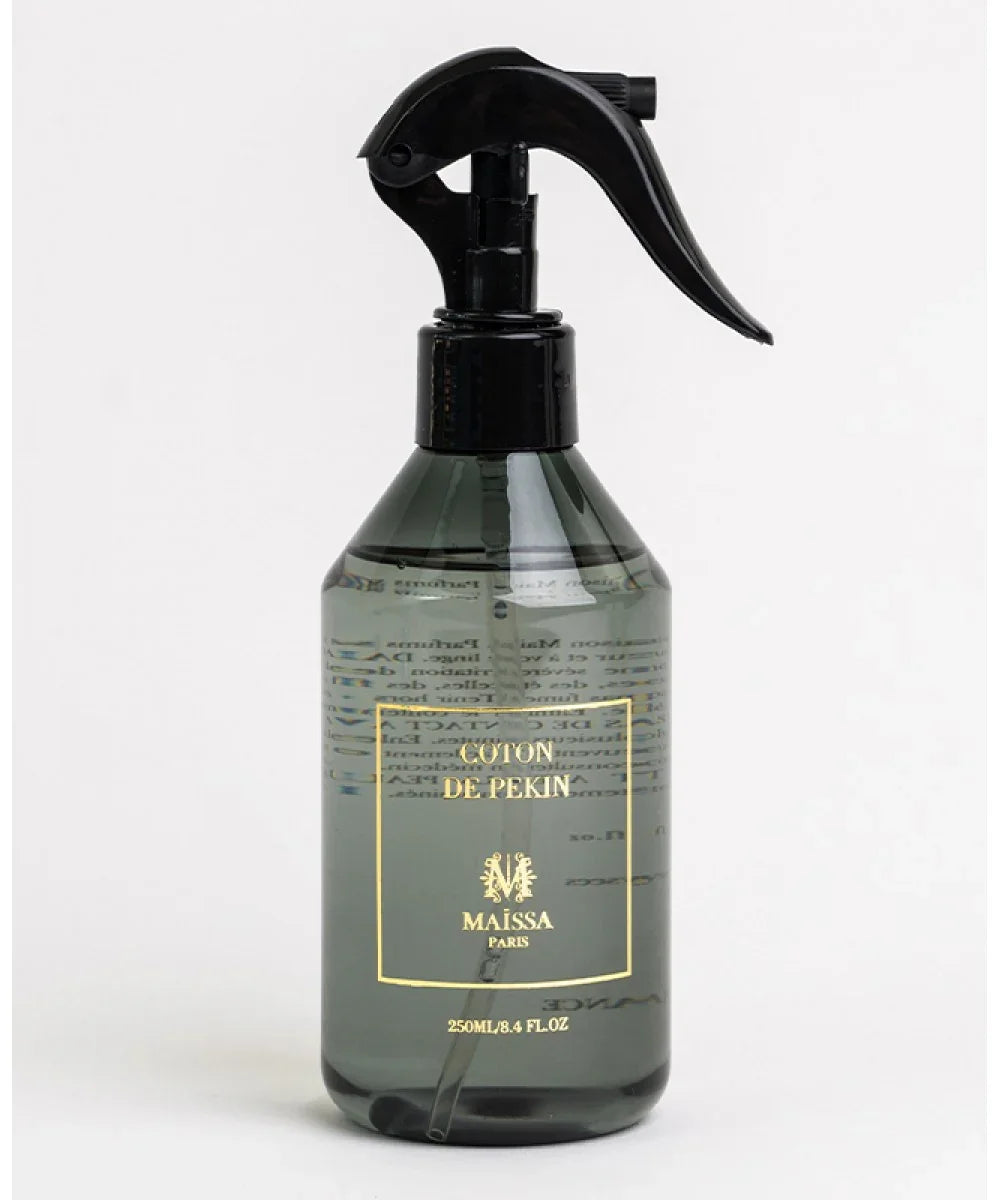 Transparent spray bottle with black trigger labeled Coton de Pekin Maissa Paris 250ml on white background