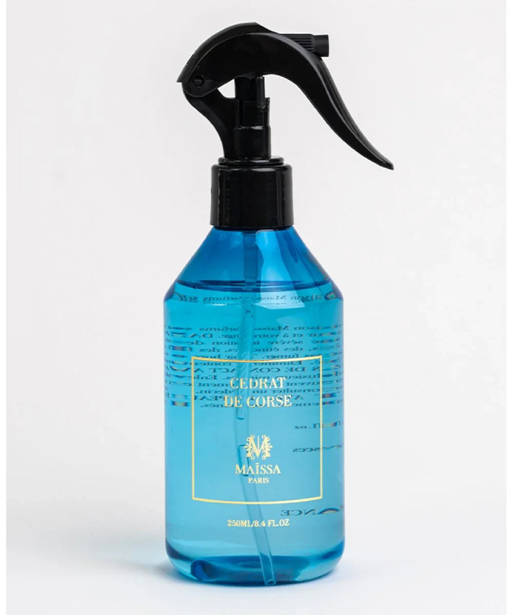 Blue spray bottle labeled Cedrat de Corse by Maissa Paris with black trigger on white background