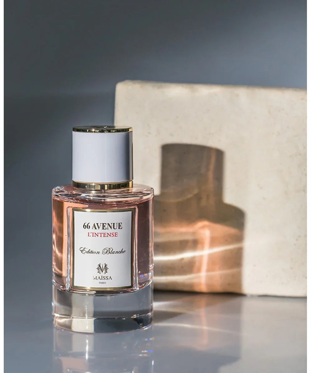 66 Avenue L'Intense Edition Blanche perfume bottle by Maïssa Paris with pink liquid and gold accents