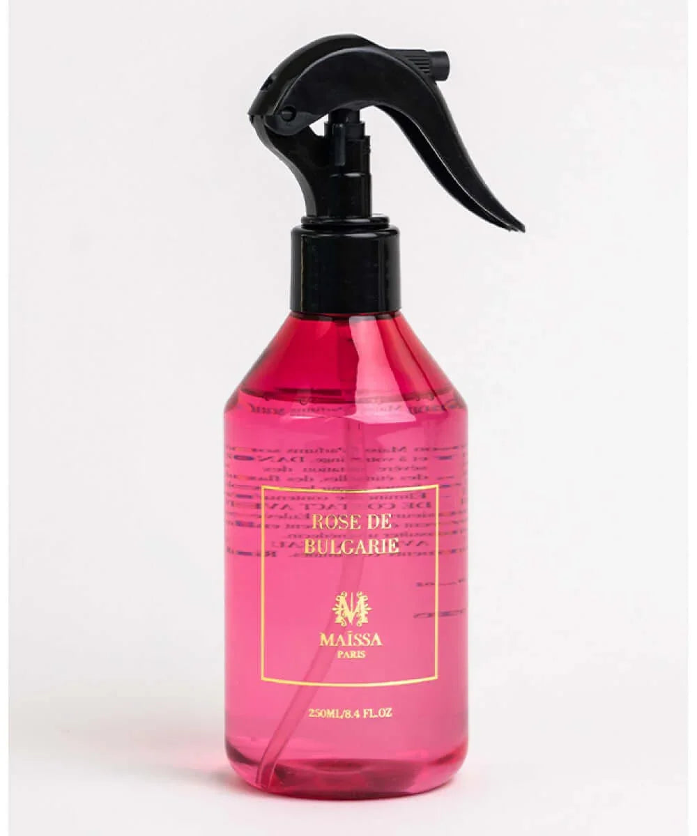 Pink spray bottle of Rose de Bulgarie fragrance by Maissa Paris with black trigger nozzle