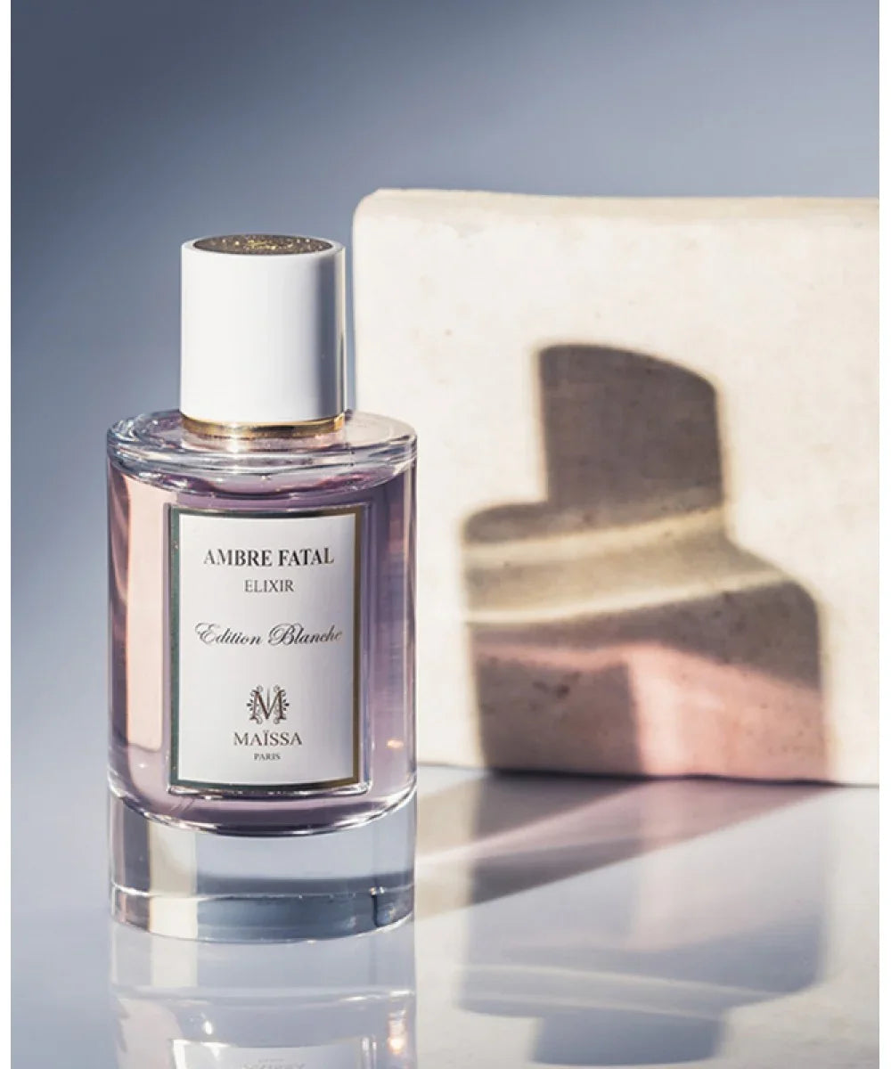 Amber Fatal Elixir Edition Blanche perfume bottle with pink liquid and white cap