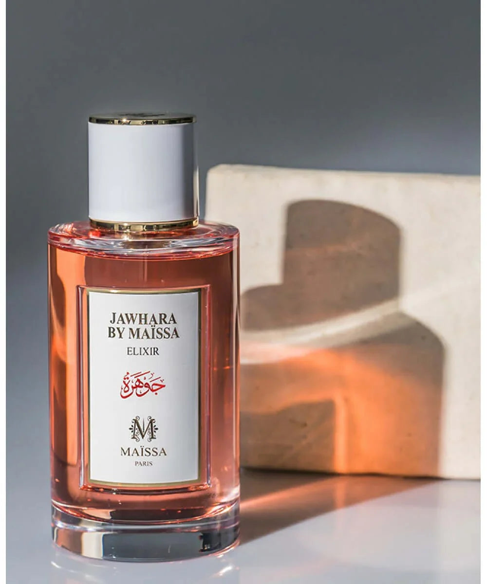 Jawhara by Maïssa Elixir perfume bottle with pink liquid and white cap