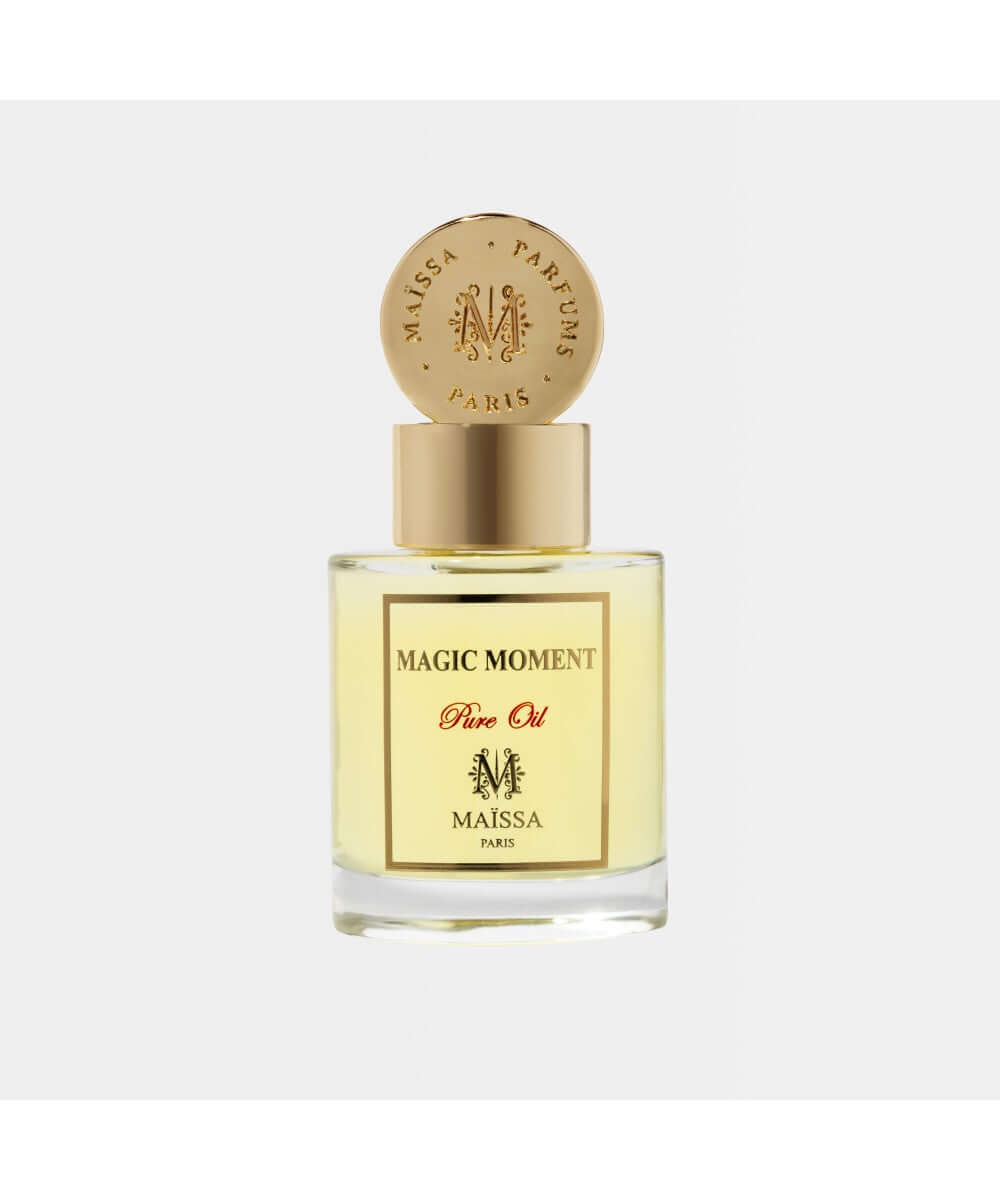 Luxurious PURE OIL MAGIC MOMENT perfume by Maison Maïssa in an elegant glass bottle, featuring a woody and sweet fragrance by the5thscent.