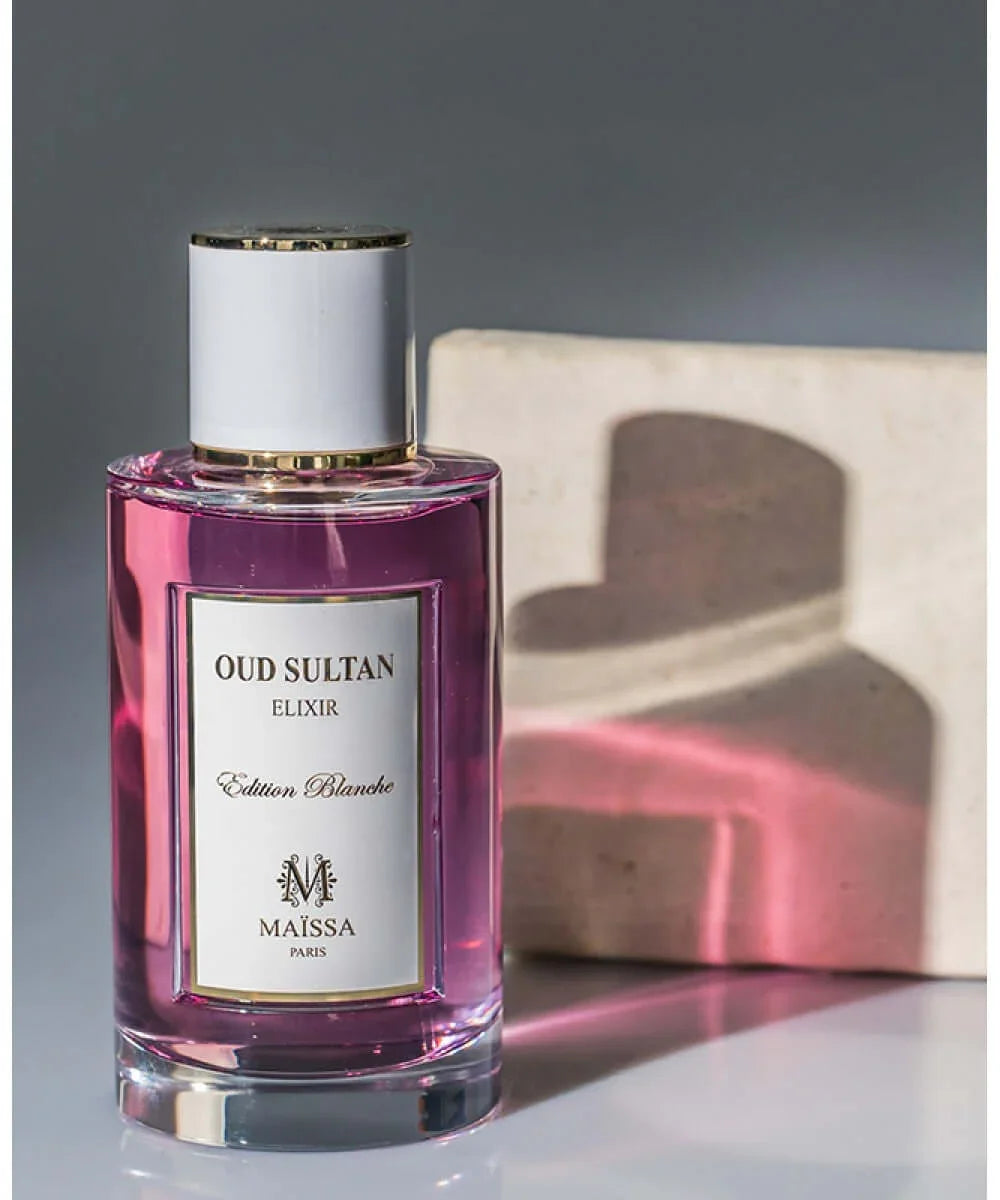 Maïssa Paris Oud Sultan Elixir Edition Blanche perfume bottle with purple liquid and white gold-trimmed cap