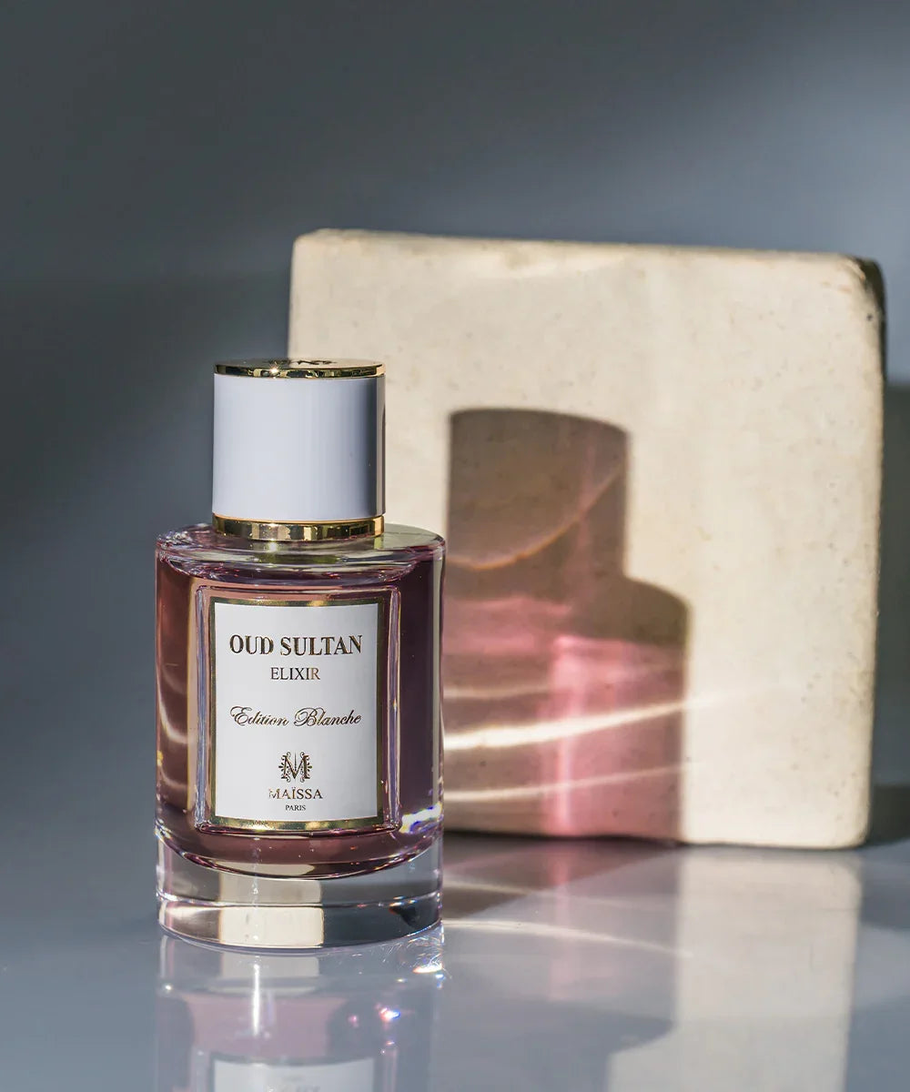 Maïssa Paris Oud Sultan Elixir Edition Blanche perfume bottle with pink liquid and white cap