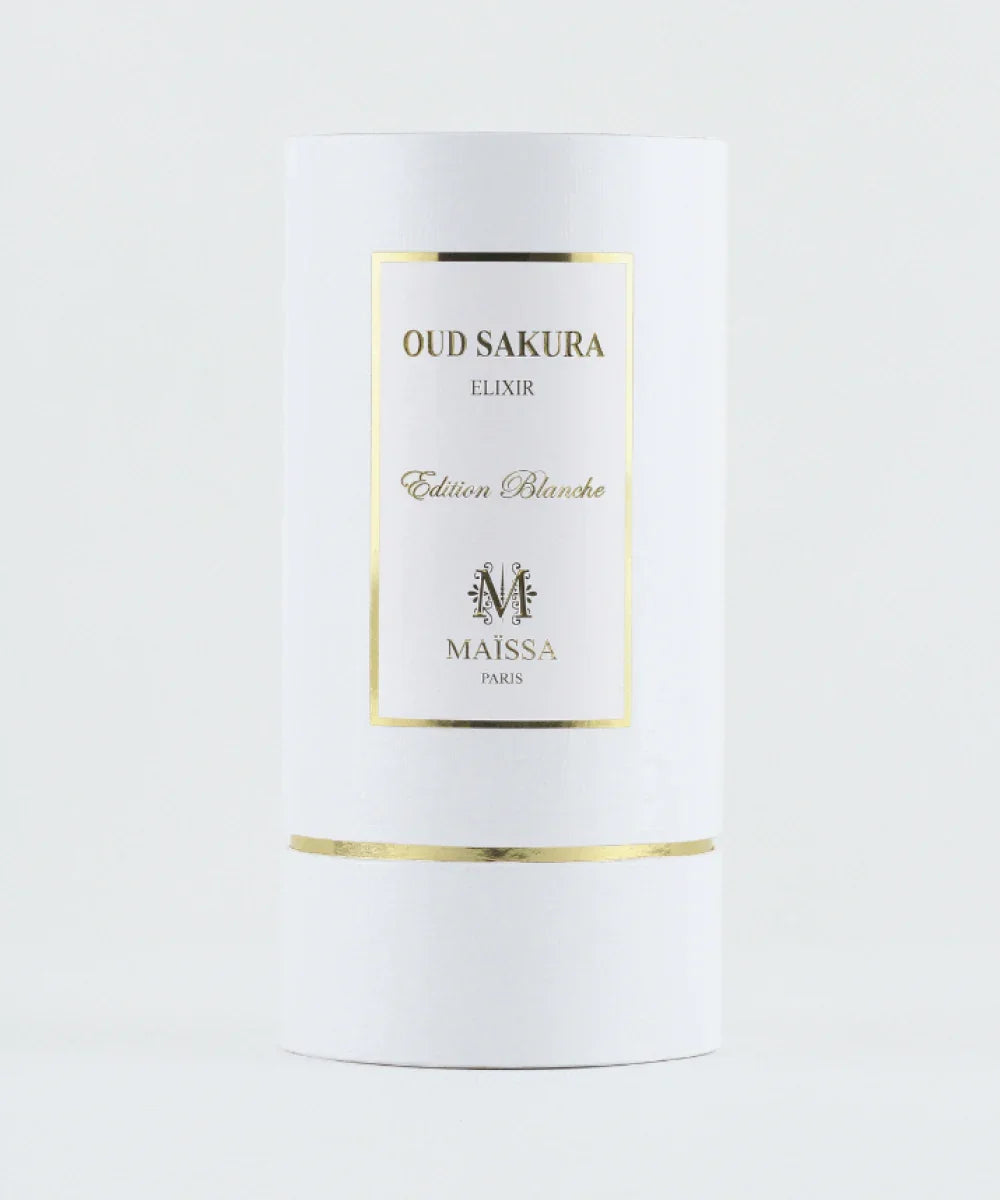 Oud Sakura Elixir perfume bottle with pink liquid and white gold-trimmed label and cap