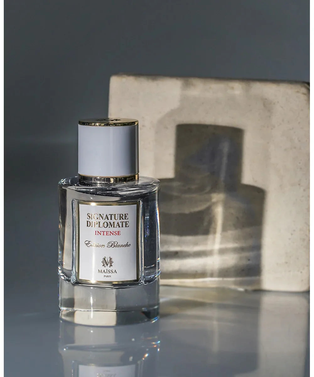 Signature Diplomate Intense Edition Blanche perfume bottle by Maïssa Paris with gold accents