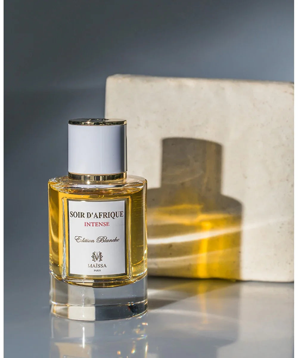 Soir d'Afrique Intense Edition Blanche perfume bottle by Maissa Paris with golden liquid