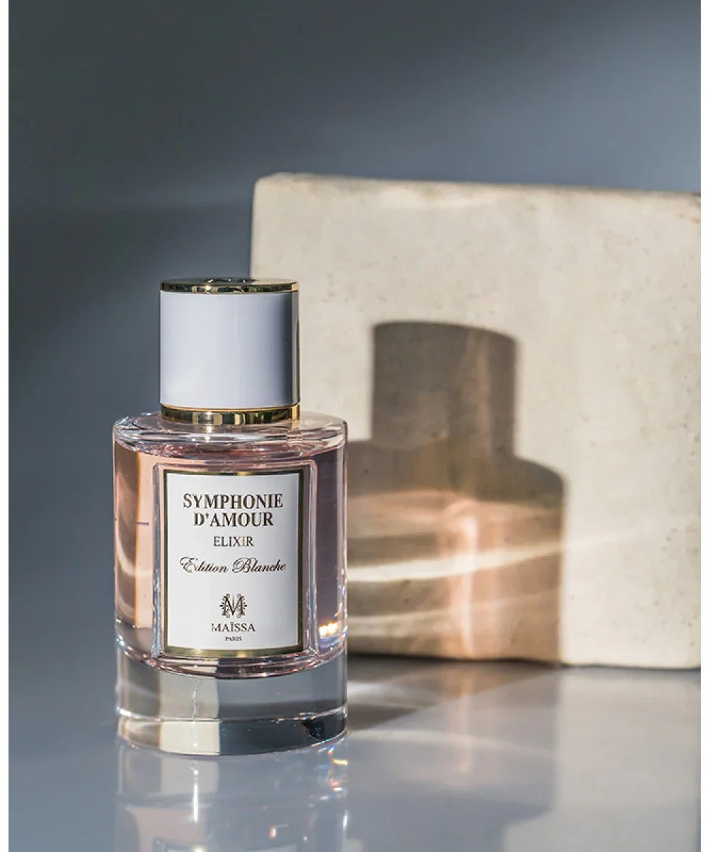 Symphonie d'Amour Elixir Edition Blanche perfume bottle by Maïssa Paris with pink liquid