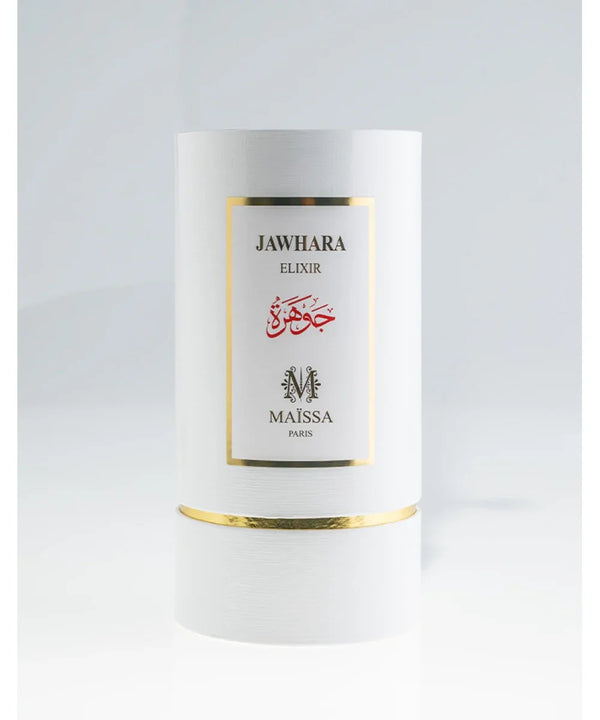 White cylindrical perfume box with gold trim labeled Jawhara Elixir by Maissa Paris