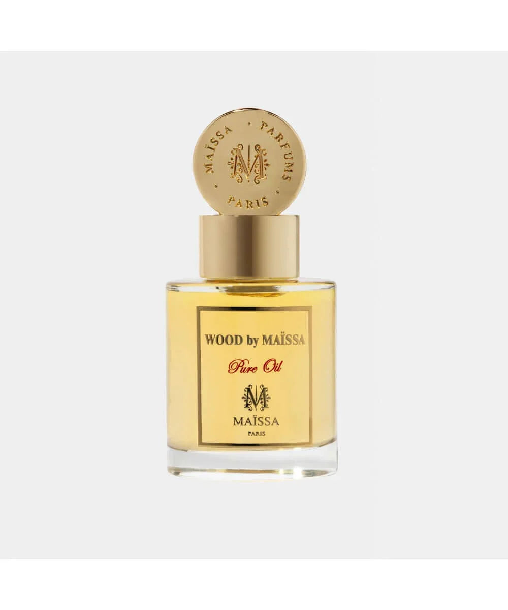 Wood by Maïssa pure oil perfume in a clear glass bottle with gold cap and Paris branding
